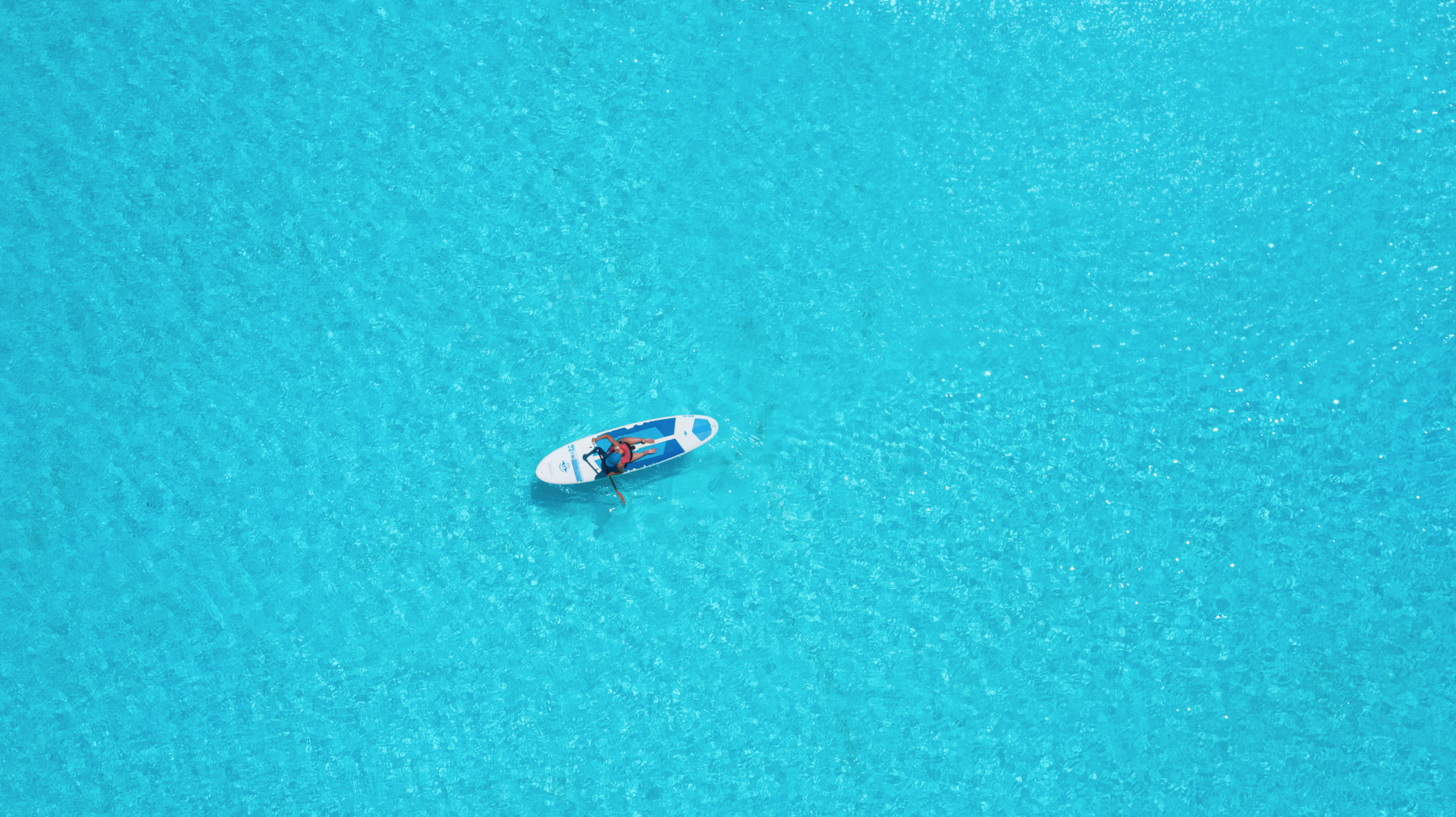 Aerial view of a pure turquoise lagoon powered by Crystal Lagoons technology