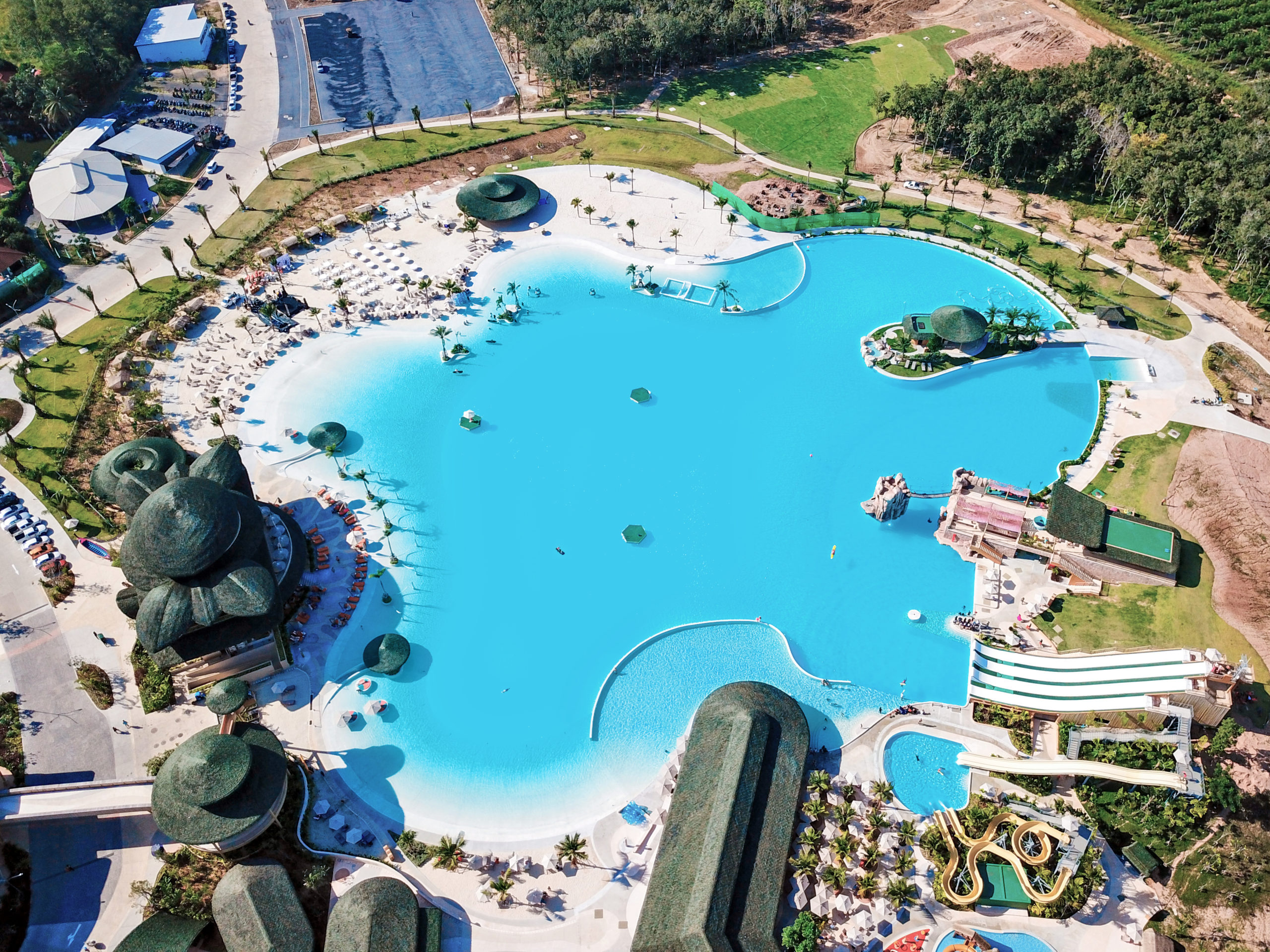An aerial view of a pure crystalline lagoon powered by Crystal Lagoons technology called Blue Tree Phuket, in Thailand