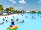 People swimming in Epperson Public Access Lagoon by Crystal Lagoons in Florida