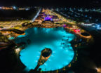 Aerial view of a crystalline lagoon surrounded lights